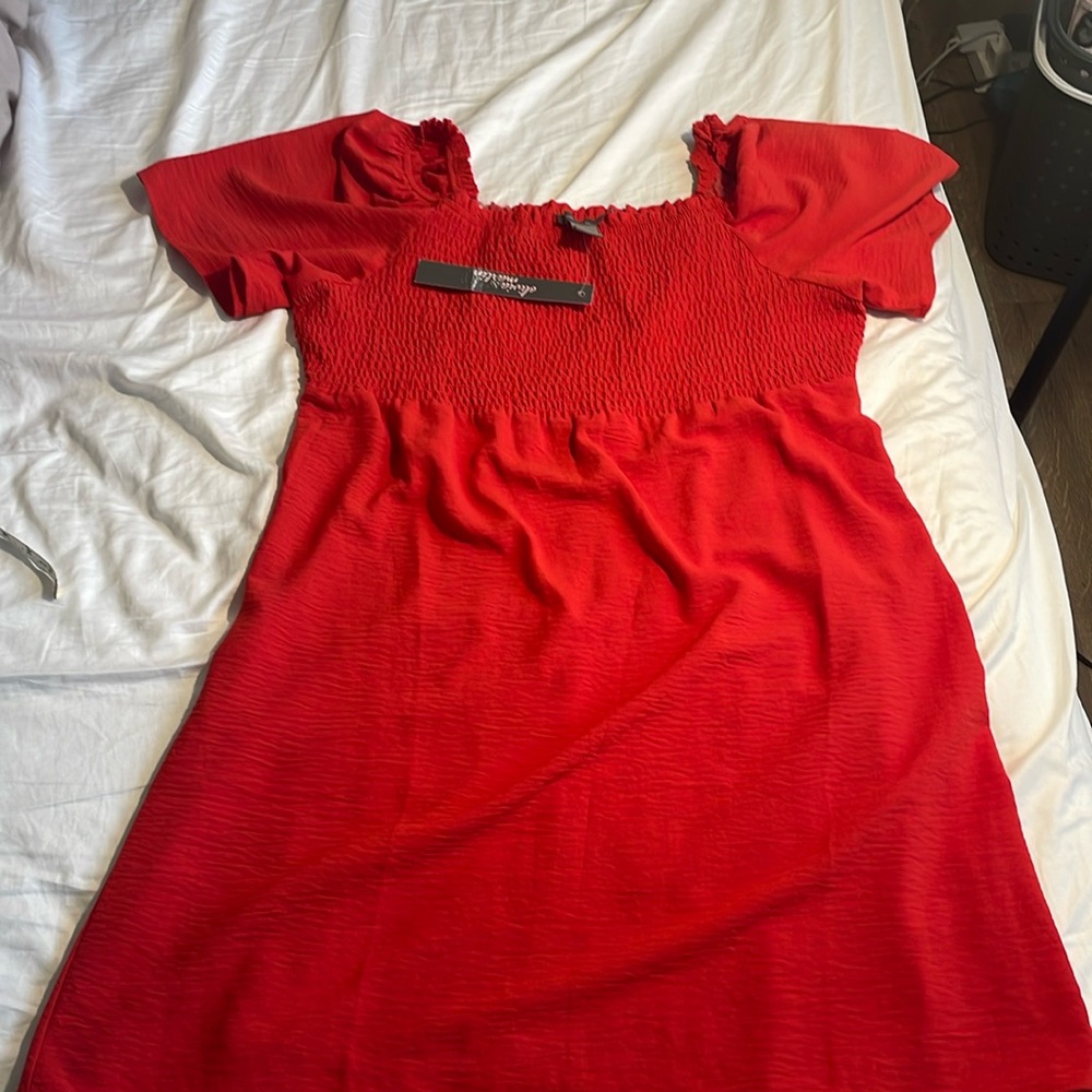 Olivia & Martin, petite XL mini dress. Smocked front and flutter sleeves.
